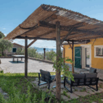 Camera Blu outdoor patio. Pergola, seating, and ping pong table. Holiday rental with sea view.