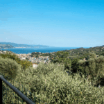 Casa di Pietra, Italy view. Coastal Italian town with ocean and mountain views. Vacation destination.